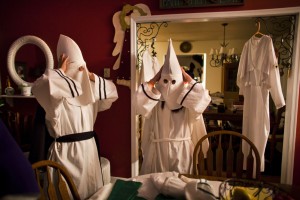 Two female members of the Knights of the Southern Cross of the Ku Klux Klan (KSCKKK) dawn their robes and hoods inside the home of a KSCKKK member just before the start of a cross lighting ceremony on private property near Powhatan, Virginia, USA, 28 May 2011. (EPA/JIM LO SCALZO)